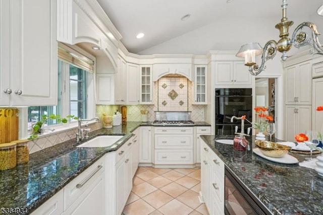 82 Mohawk Rd, Millburn Twp, NJ 07078 - kitchen featuring lofted ceiling, tasteful backsplash, glass insert cabinets, white cabinets, and light tile patterned flooring