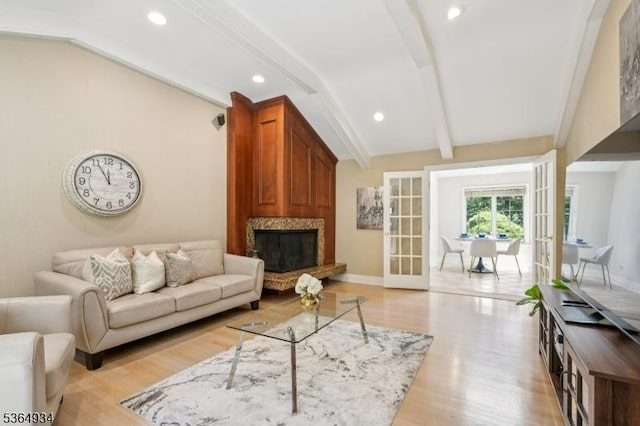 82 Mohawk Rd, Millburn Twp, NJ 07078 - living area with french doors, light wood-type flooring, a high end fireplace, and recessed lighting