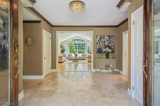 82 Mohawk Rd, Millburn Twp, NJ 07078 - entryway with a chandelier and ornamental molding
