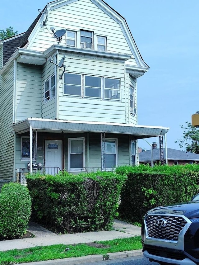 341 N Grove St, East Orange City, NJ 07017 - colonial inspired home with a gambrel roof and a porch