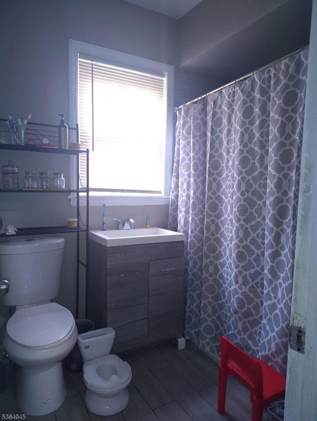 341 N Grove St, East Orange City, NJ 07017 - bathroom with plenty of natural light, vanity, and wood finished floors