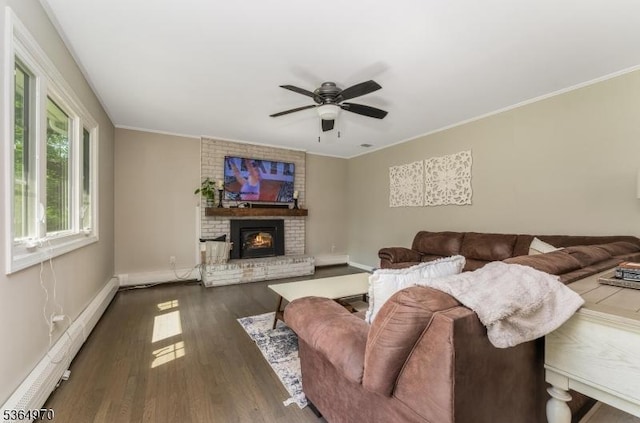 25 Old Turnpike Rd, Washington Twp, NJ 07865 - living area with a baseboard heating unit, a brick fireplace, ceiling fan, dark wood finished floors, and crown molding