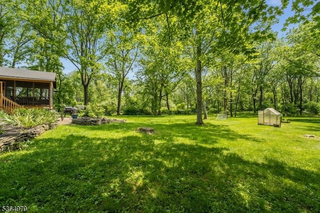 25 Old Turnpike Rd, Washington Twp, NJ 07865 - view of grassy yard with an exterior structure, a sunroom, and an outdoor structure