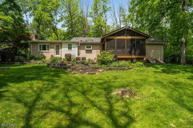 25 Old Turnpike Rd, Washington Twp, NJ 07865 - back of house featuring a sunroom, brick siding, a yard, and a chimney