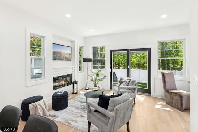 944 Orange Ave, Cranford Twp, NJ 07016 - living area featuring plenty of natural light, light wood-style floors, recessed lighting, and a glass covered fireplace