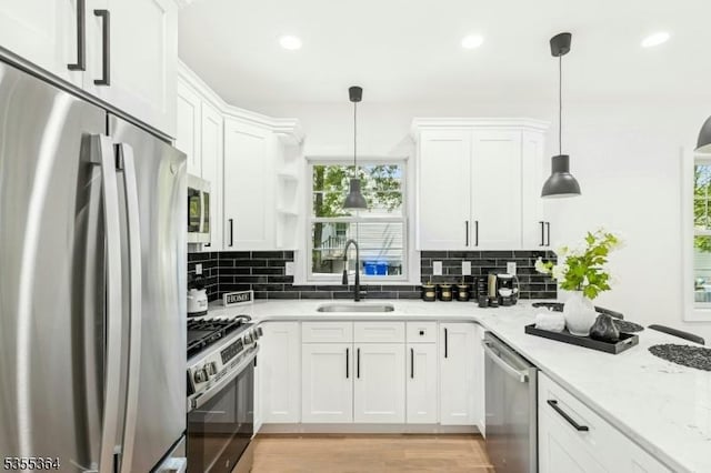 944 Orange Ave, Cranford Twp, NJ 07016 - kitchen featuring appliances with stainless steel finishes, white cabinets, backsplash, light stone counters, and recessed lighting