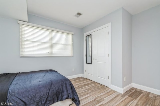 14 Lenox Ave, Green Brook Twp, NJ 08812 - bedroom with light wood-type flooring and a closet