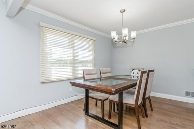 14 Lenox Ave, Green Brook Twp, NJ 08812 - dining room with a chandelier, ornamental molding, and light wood-style floors