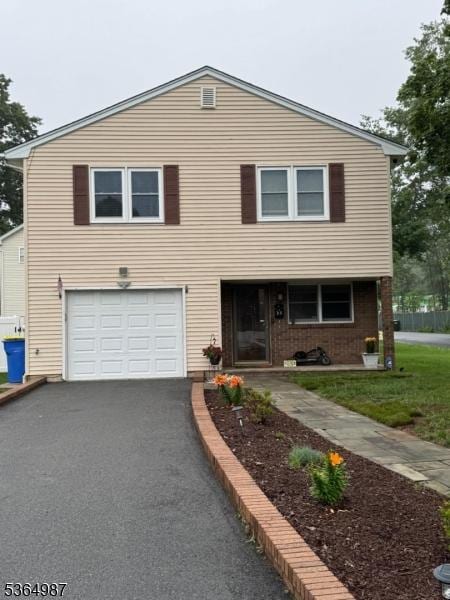 14 Lenox Ave, Green Brook Twp, NJ 08812 - view of front of property with a garage and asphalt driveway
