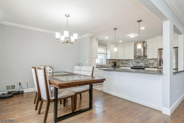 14 Lenox Ave, Green Brook Twp, NJ 08812 - dining space featuring crown molding, a chandelier, light wood-style flooring, and recessed lighting