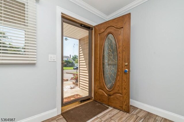 14 Lenox Ave, Green Brook Twp, NJ 08812 - entrance foyer featuring light wood-type flooring and crown molding