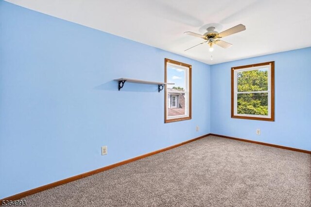 1033 Huff Ave, Manville Boro, NJ 08835 - carpeted empty room featuring a ceiling fan and baseboards