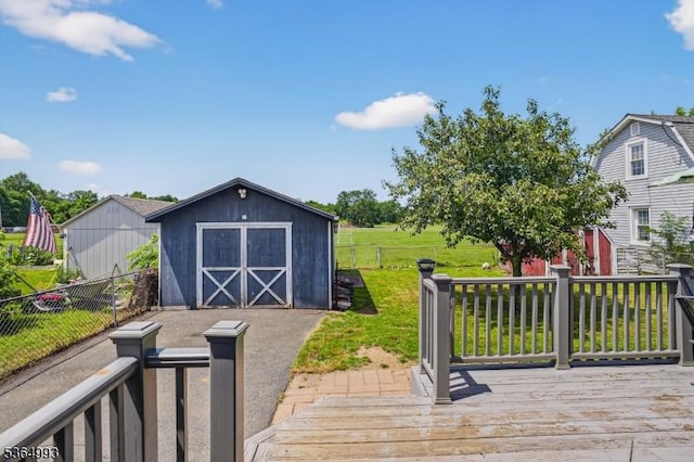 1033 Huff Ave, Manville Boro, NJ 08835 - wooden terrace featuring a storage unit