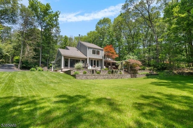 16 Forest Dr, Hampton Twp, NJ 07860 - back of house featuring a yard and a sunroom