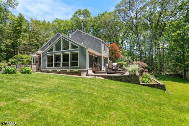 16 Forest Dr, Hampton Twp, NJ 07860 - back of property with a lawn and a patio
