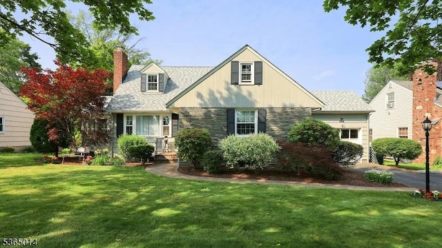 120 Meadowbrook Dr, North Plainfield Boro, NJ 07062 - view of front facade featuring a front lawn, an attached garage, a chimney, and stone siding
