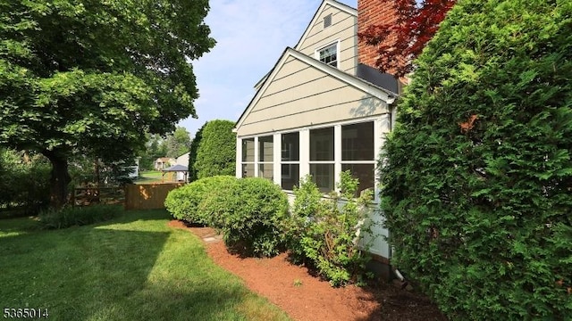 120 Meadowbrook Dr, North Plainfield Boro, NJ 07062 - view of home's exterior featuring a lawn and a chimney