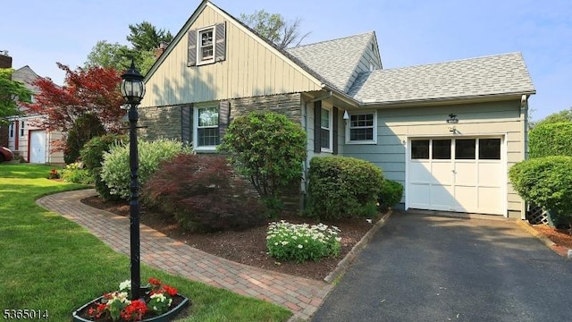 120 Meadowbrook Dr, North Plainfield Boro, NJ 07062 - view of front facade with asphalt driveway, board and batten siding, an attached garage, roof with shingles, and stone siding