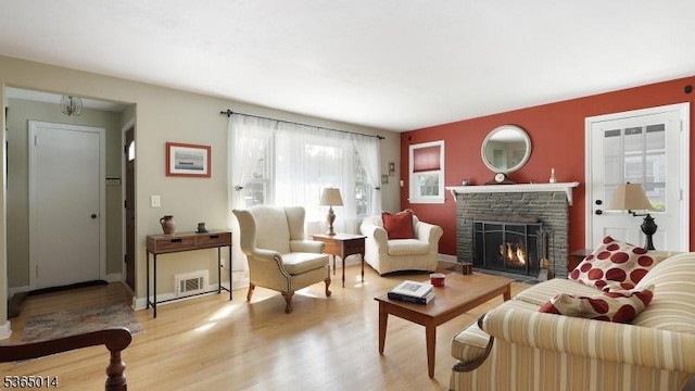 120 Meadowbrook Dr, North Plainfield Boro, NJ 07062 - living room with a stone fireplace and light wood-type flooring
