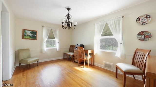 120 Meadowbrook Dr, North Plainfield Boro, NJ 07062 - sitting room with a chandelier and light wood finished floors