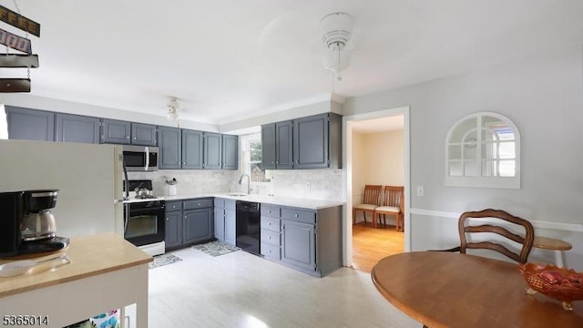 120 Meadowbrook Dr, North Plainfield Boro, NJ 07062 - kitchen with gas range oven, dishwasher, stainless steel microwave, tasteful backsplash, and gray cabinetry