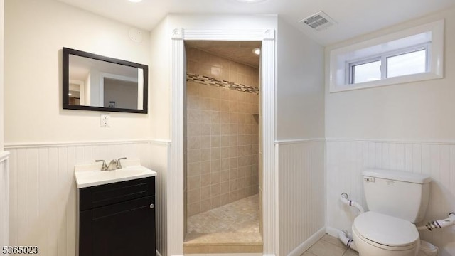 122 Madison St, South Bound Brook Boro, NJ 08880 - bathroom with vanity, a walk in shower, a wainscoted wall, and tile patterned floors