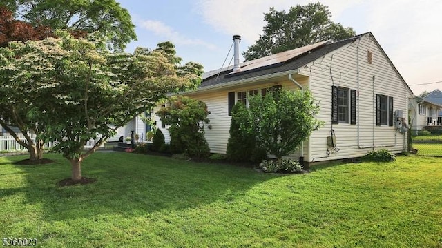 122 Madison St, South Bound Brook Boro, NJ 08880 - view of home's exterior featuring roof mounted solar panels