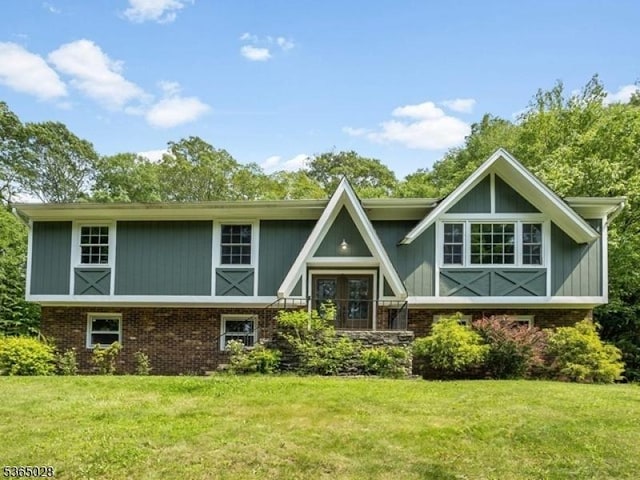 16 Seneca Trl, Randolph Twp, NJ 07869 - rear view of house with a lawn and brick siding