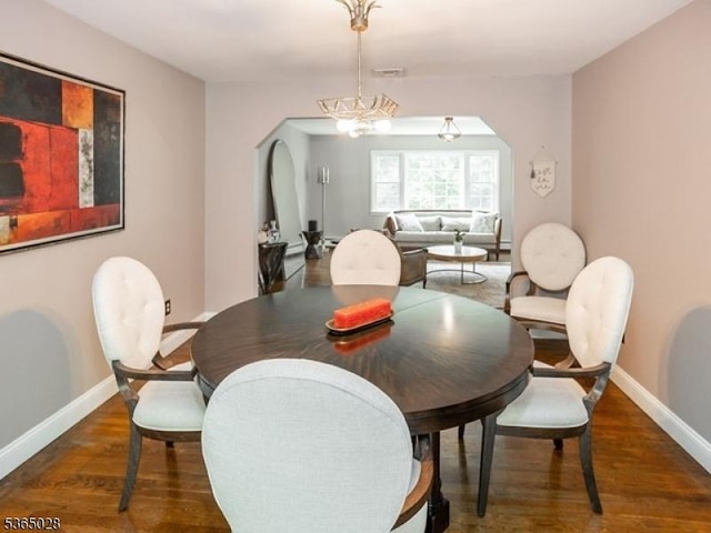 16 Seneca Trl, Randolph Twp, NJ 07869 - dining area with arched walkways, wood finished floors, and a chandelier