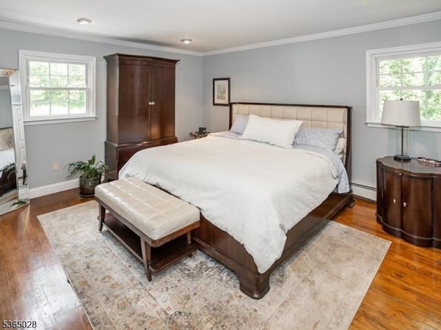 16 Seneca Trl, Randolph Twp, NJ 07869 - bedroom with multiple windows, wood finished floors, ornamental molding, and a baseboard heating unit