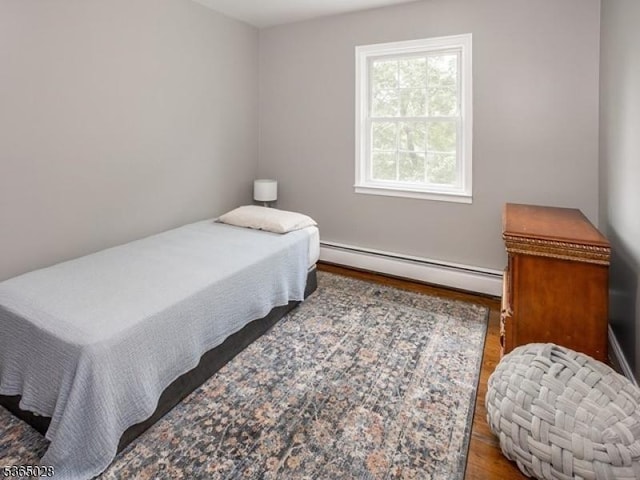 16 Seneca Trl, Randolph Twp, NJ 07869 - bedroom with baseboard heating and wood finished floors