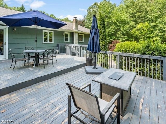 16 Seneca Trl, Randolph Twp, NJ 07869 - wooden deck with outdoor dining space