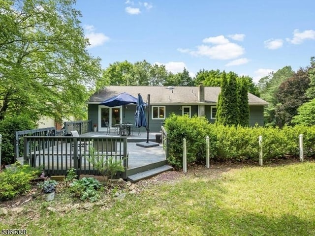 16 Seneca Trl, Randolph Twp, NJ 07869 - back of house with a lawn and a wooden deck