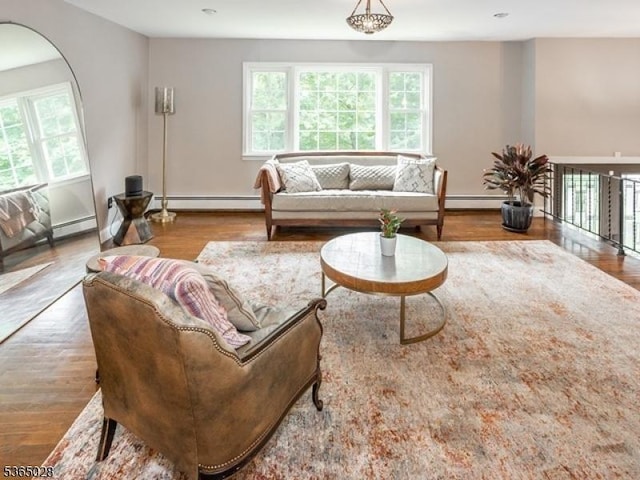 16 Seneca Trl, Randolph Twp, NJ 07869 - living area featuring healthy amount of natural light, wood finished floors, and a baseboard radiator