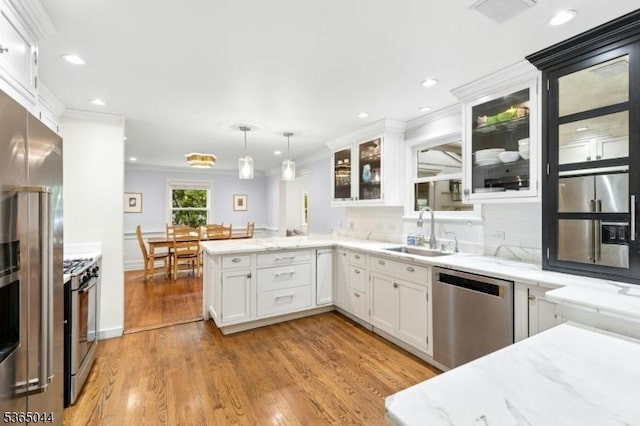 849 Bradford Ave, Westfield Town, NJ 07090 - kitchen with stainless steel appliances, a peninsula, crown molding, white cabinets, and recessed lighting