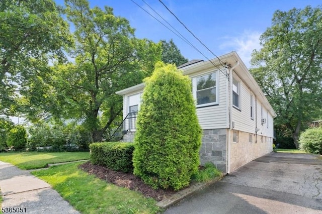 268 Warburton Ave, Hawthorne Boro, NJ 07506 - view of side of home with a yard and stone siding