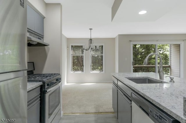 44 Sam Bonnell Dr, Union Twp, NJ 08809 - kitchen featuring appliances with stainless steel finishes, under cabinet range hood, gray cabinetry, light carpet, and light stone countertops