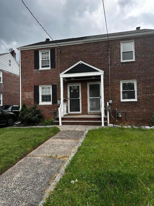 345 Raleigh Rd, Rahway City, NJ 07065 - multi unit property with brick siding and a front yard