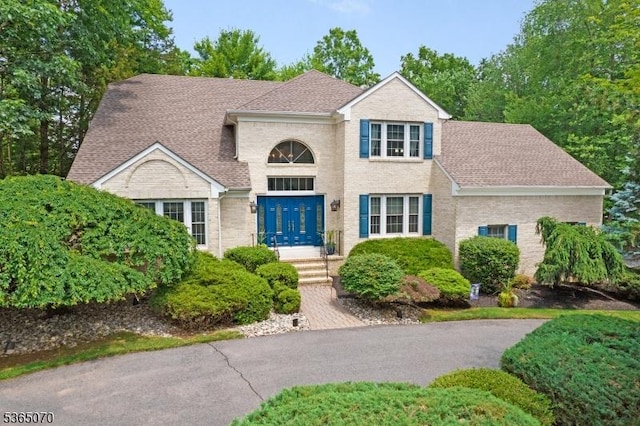 3310 Round Hill Rd, Branchburg Twp, NJ 08876 - view of front of home featuring a shingled roof and brick siding
