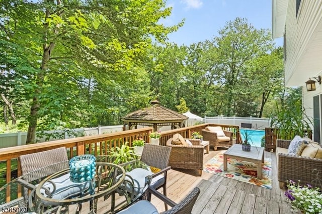 3310 Round Hill Rd, Branchburg Twp, NJ 08876 - deck with an outdoor hangout area, outdoor dining area, a gazebo, and a fenced backyard