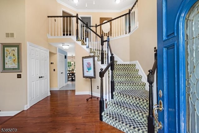 3310 Round Hill Rd, Branchburg Twp, NJ 08876 - foyer entrance featuring wood finished floors, stairs, a high ceiling, and crown molding