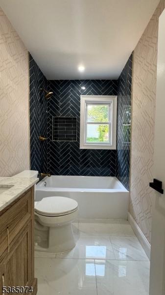 882 Lafayette Ave, Hawthorne Boro, NJ 07506 - bathroom with vanity, shower / washtub combination, and marble tiled flooring