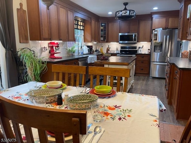 126 Hilltop Trl, Sparta Twp, NJ 07871 - kitchen featuring stainless steel appliances, dark wood-style floors, decorative backsplash, glass insert cabinets, and recessed lighting