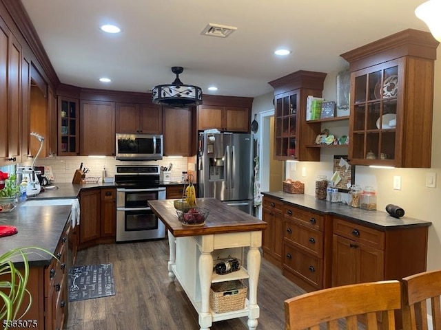 126 Hilltop Trl, Sparta Twp, NJ 07871 - kitchen with appliances with stainless steel finishes, open shelves, dark wood finished floors, tasteful backsplash, and recessed lighting