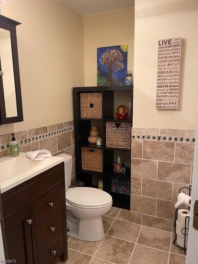 126 Hilltop Trl, Sparta Twp, NJ 07871 - bathroom with tile walls, vanity, and a wainscoted wall