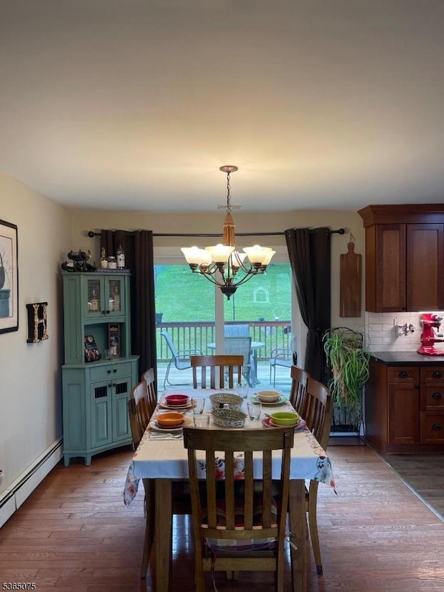 126 Hilltop Trl, Sparta Twp, NJ 07871 - dining room with a baseboard radiator, light wood-style flooring, and a chandelier