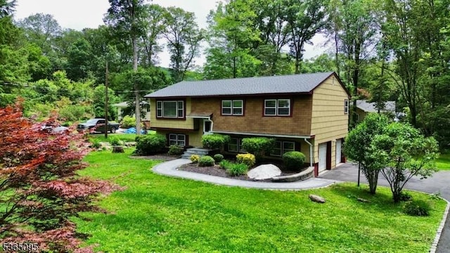25 Lockwood Ave, Byram Twp, NJ 07874 - view of front of home with a garage, driveway, and a front lawn