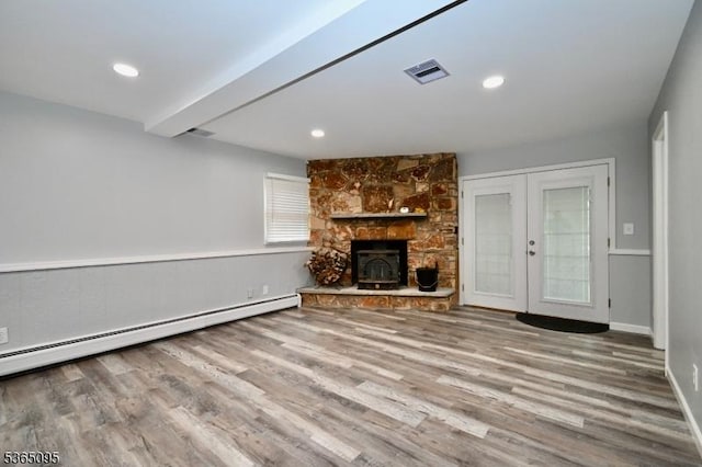 25 Lockwood Ave, Byram Twp, NJ 07874 - unfurnished living room featuring french doors, wood finished floors, a baseboard heating unit, a fireplace, and beam ceiling
