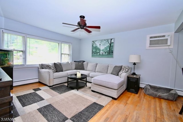 25 Lockwood Ave, Byram Twp, NJ 07874 - living room featuring a baseboard radiator, a wall mounted air conditioner, wood finished floors, and a ceiling fan