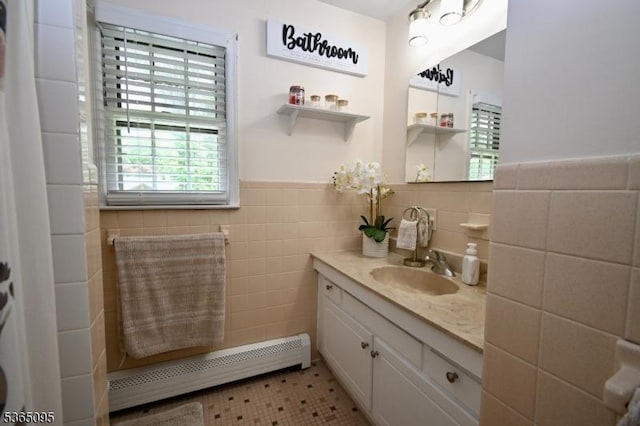 25 Lockwood Ave, Byram Twp, NJ 07874 - bathroom featuring baseboard heating, tile walls, vanity, and wainscoting
